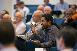 Photograph of Vikram Gadagkar asking a question at the Simons Meeting